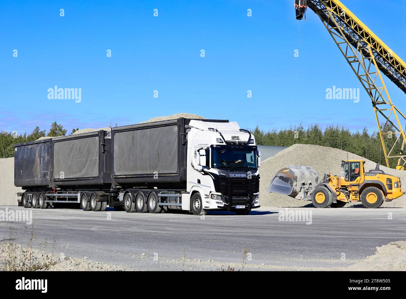 Foamit foam glass aggregate being loaded onto Scania 560R pulled trailer at Uusioaines Oy production plant in Forssa, Finland. September 9, 2022. Stock Photo