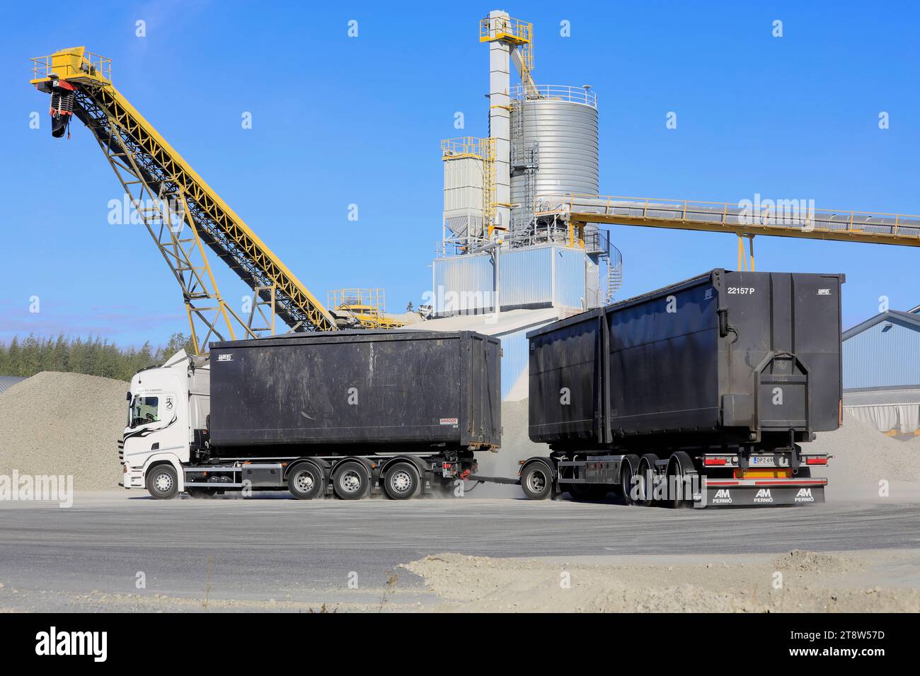 Scania truck and trailer begin the delivery of foam glass aggregate after loading at Uusioaines Oy production plant. Forssa, Finland. Sept 9, 2022. Stock Photo