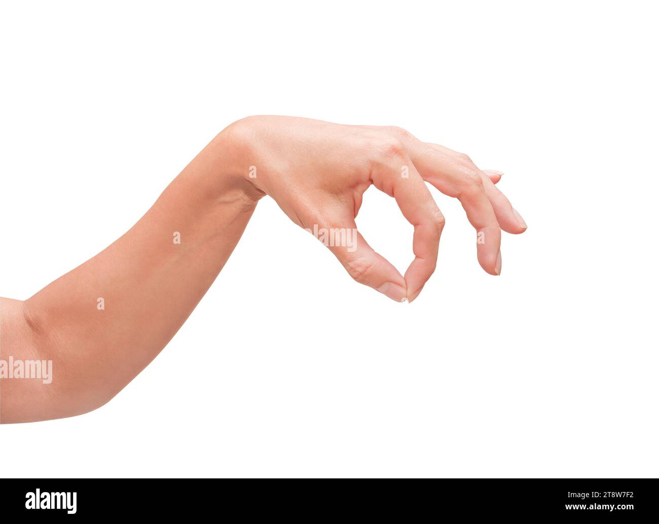 Woman hand picking up some items, female well - groomed fingers, isolated on white background with clipping path Stock Photo