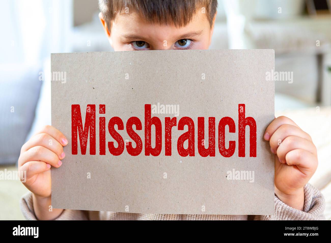 November 21, 2023 Child holding a sign with red lettering Abuse