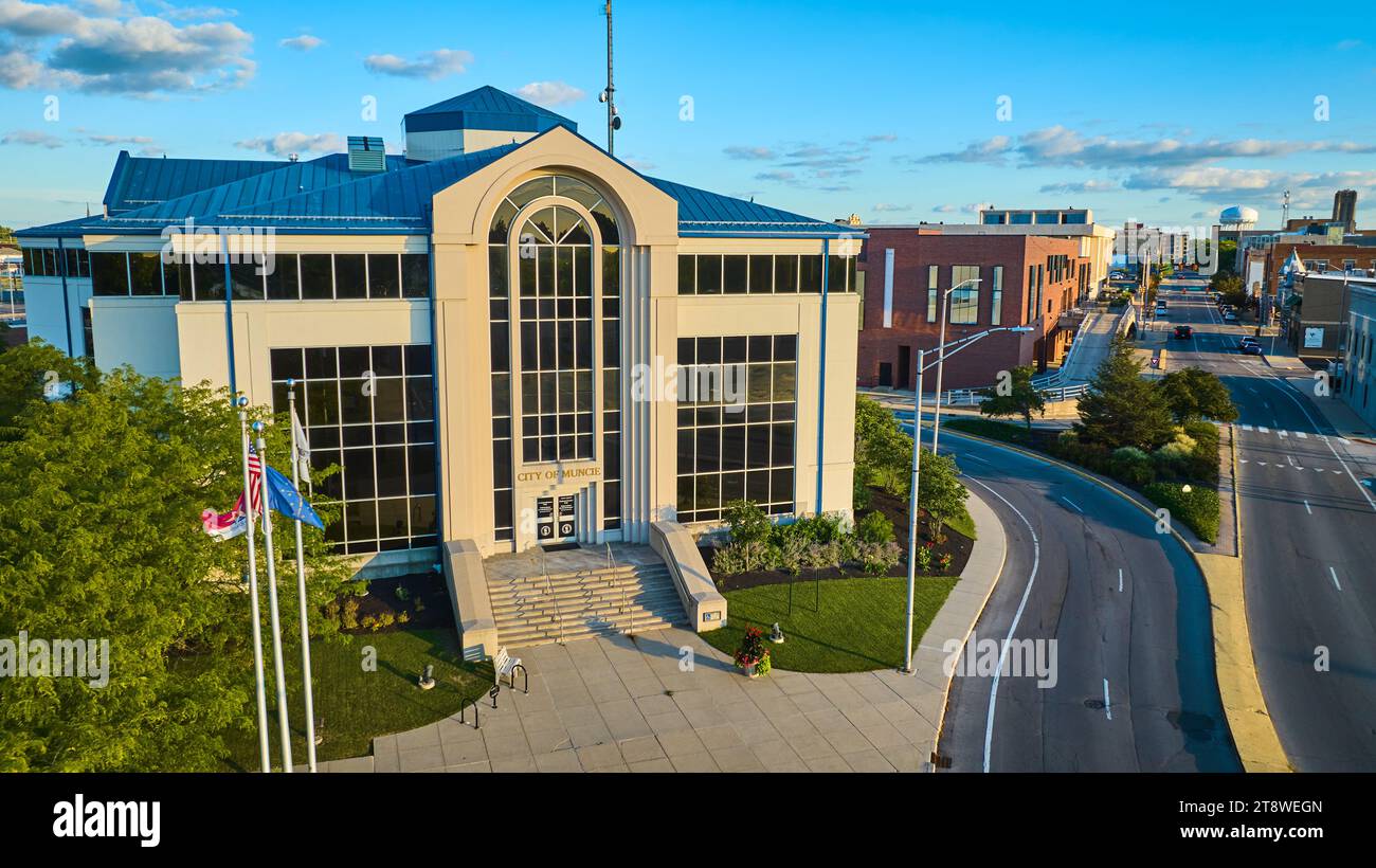 City of Muncie building aerial at sunset with blue sky and street through downtown