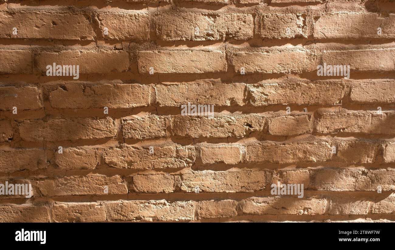 Rough grunge orange brick wall texture background Stock Photo - Alamy