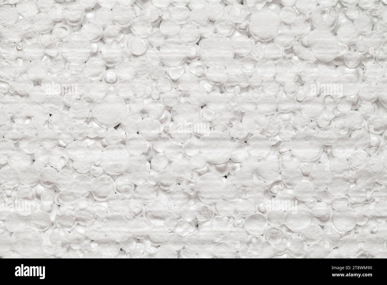Expanded polystyrene foam porous material white cells circle, closeup