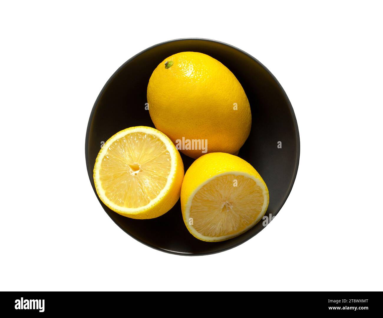 Lemons whole and cut in grey bowl, isolated on white background with ...