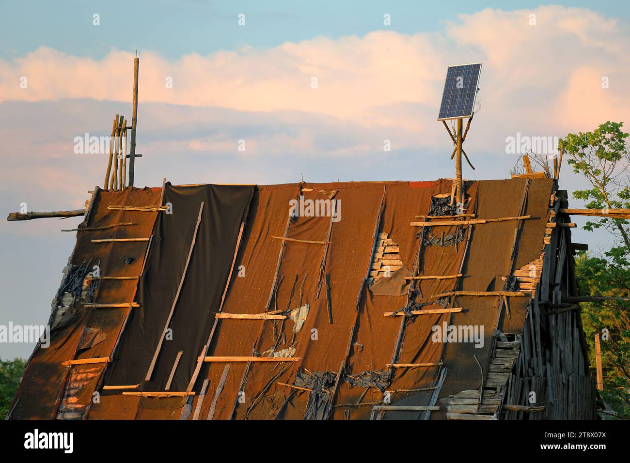 Photovoltaics instalation on a old destroyed, devastated roof Stock ...