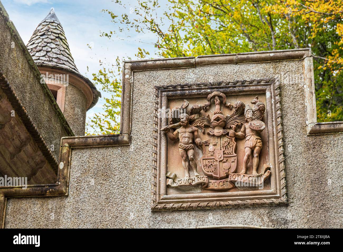 The motto of the Clan Macpherson 'Touch Not The Cat Bot A Glove' on a lodge to Ballindalloch Castle beside the River Avon at Bridge of Avon, Speyside, Stock Photo