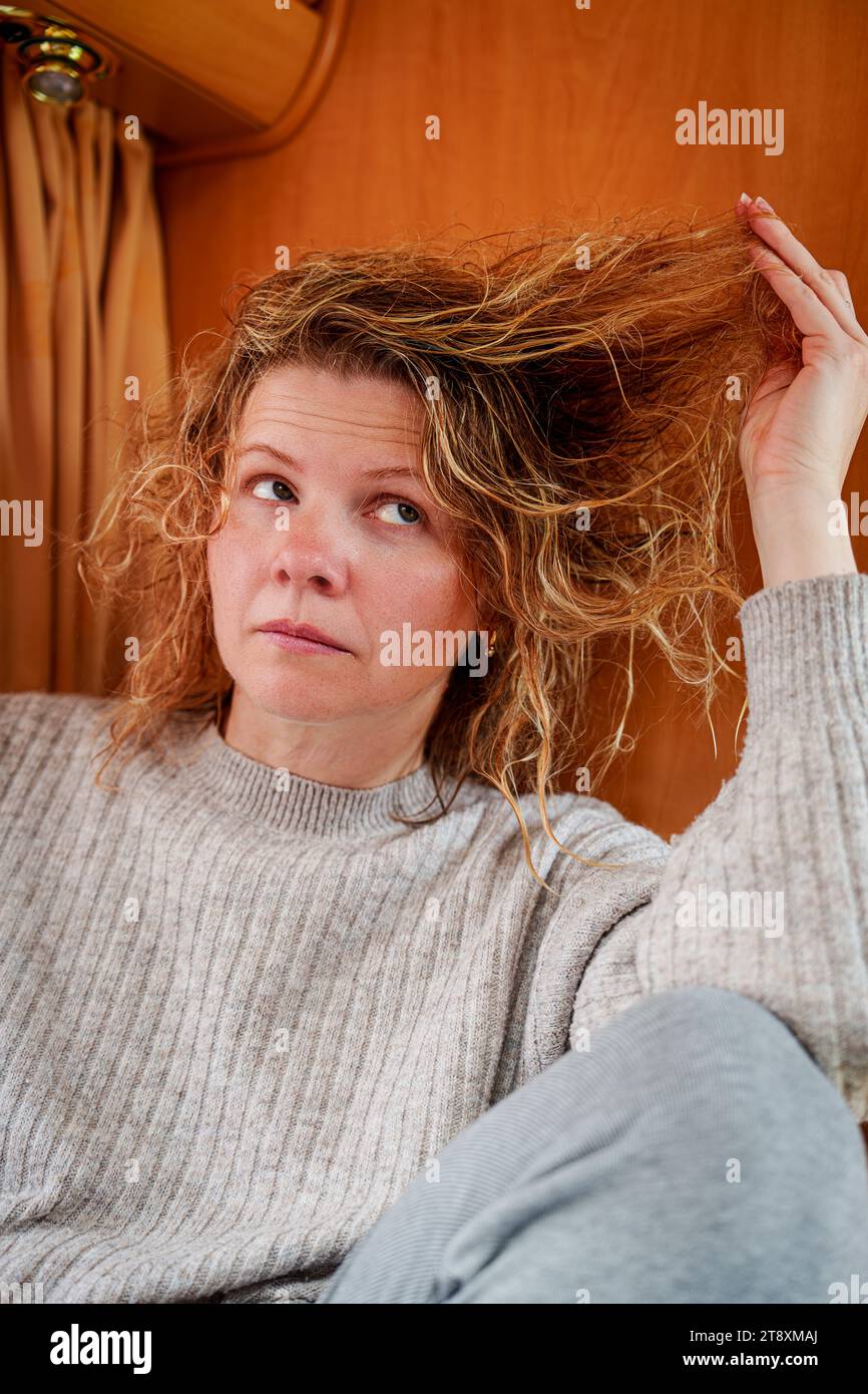Tangled Hair Being Patiently Detangled by Diligent Young Girl Stock