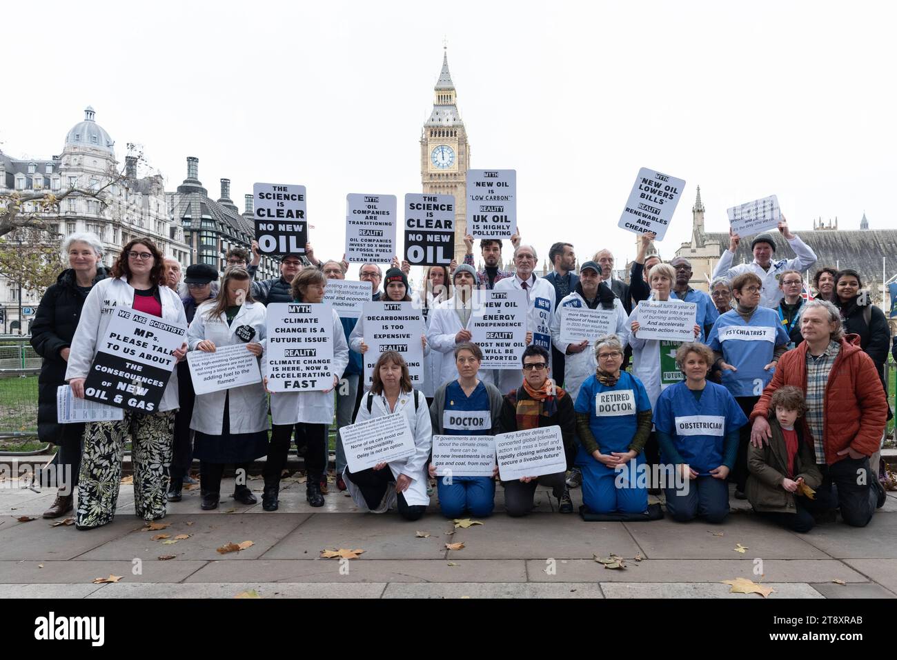 London, UK. 21 November, 2023. Scientists, health professionals, educators and campaigning organisations from the No New Oil Coalition gather in Parliament Square before going to the House of Commons to visit their MPs to lobby for greater action combating climate change. The group hope to gain support among Parliamentarians to oppose the granting of new licences for oil and gas extraction which, climate scientists say, is incompatible with meeting Paris Agreement cuts in CO2 emissions. Credit: Ron Fassbender/Alamy Live News Stock Photo