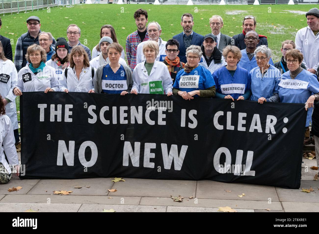 London, UK. 21 November, 2023. Scientists, health professionals, educators and campaigning organisations from the No New Oil Coalition gather in Parliament Square before going to the House of Commons to visit their MPs to lobby for greater action combating climate change. The group hope to gain support among Parliamentarians to oppose the granting of new licences for oil and gas extraction which, climate scientists say, is incompatible with meeting Paris Agreement cuts in CO2 emissions. Credit: Ron Fassbender/Alamy Live News Stock Photo