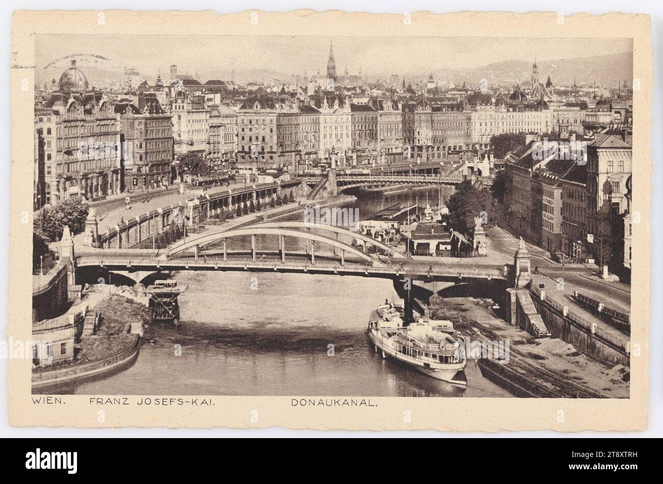Vienna. Franz Josefs-Kai. Danube Canal, Paul Ledermann (1882-1946), Producer, 1941, paperboard, rotogravure, Inscription, FROM, Vienna, TO, Prague II, ADDRESS, Frl., in, Prague II, Krakauergasse 23, MESSAGE, Herzliche Grüsse, aus Wien sendet., [signature], Danube, Donaukanal, Postcards with transliteration, 1st District: Innere Stadt, canals, waters (in city), quay, the usual house or row of houses, flat-building, apartment house, bridge, ships (in general), handwriting, written text, Franz-Josefs-Kai, The Vienna Collection Stock Photo