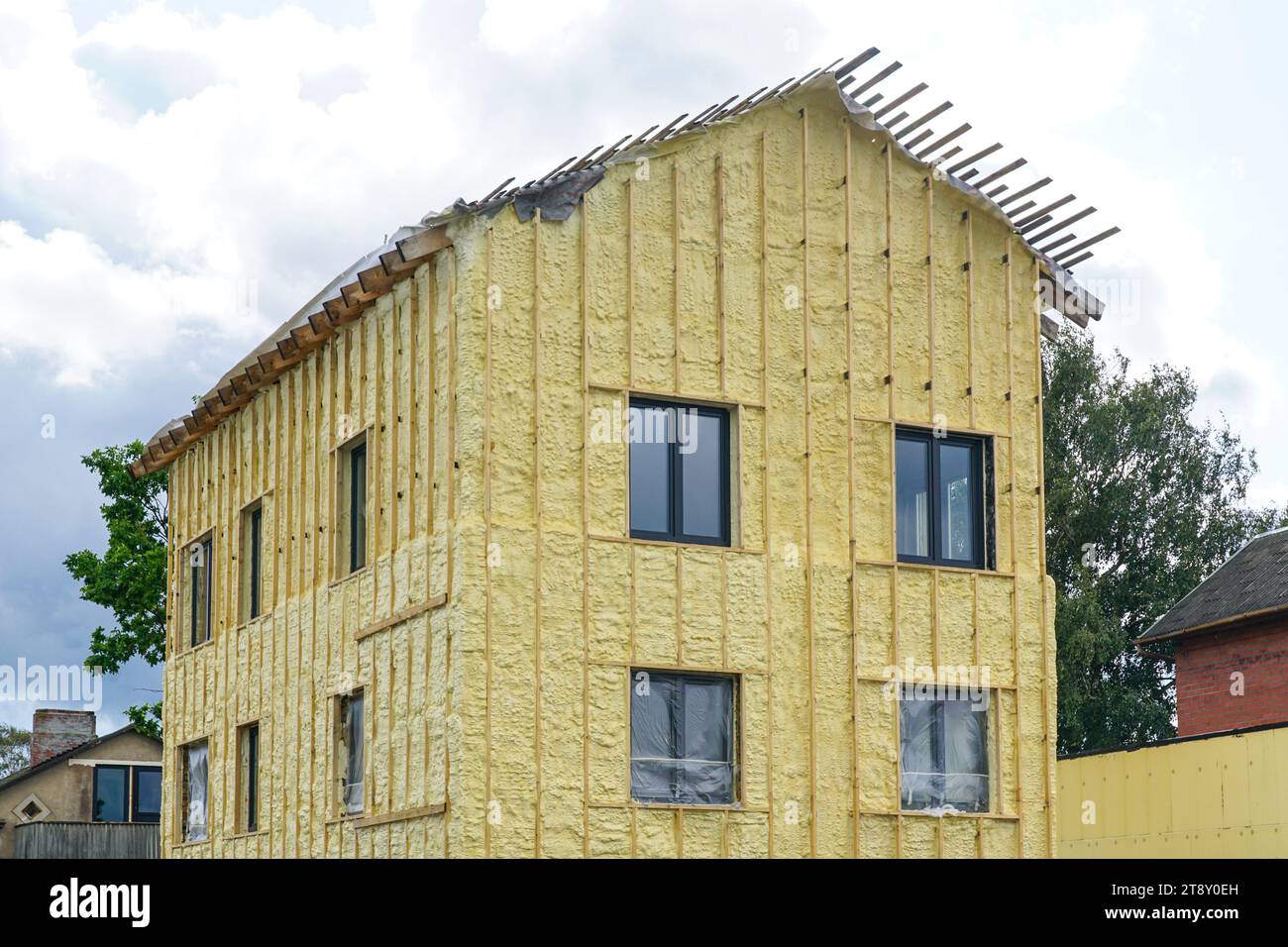 The facade of the residential house sprayed with a layer of