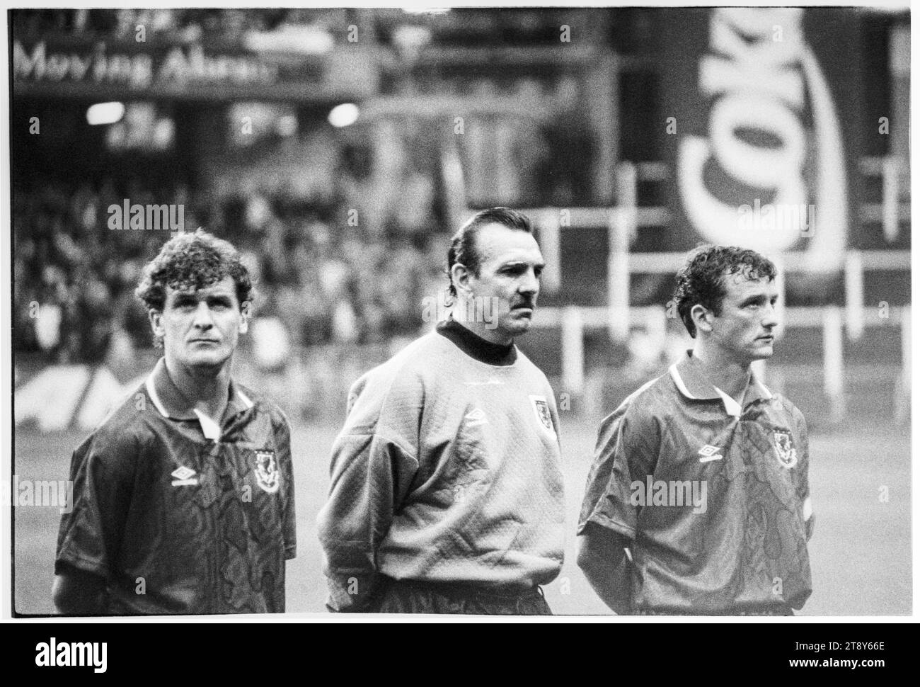 Mark Hughes, Neville Southall and captain Barry Horne during the anthems. FIFA World Cup 1994 Group 4 Qualification – Wales v RCS (Czechoslovakia AKA Representation of Czechs and Slovaks) at Cardiff Arms Park, Wales, UK on 8 September 1993. A win for Wales in this game would almost guarantee qualification with 2 group matches remaining. They led 2-1 but conceded a late free kick goal from Peter Dubovský and the match ended 2-2. Photo: Rob Watkins Stock Photo