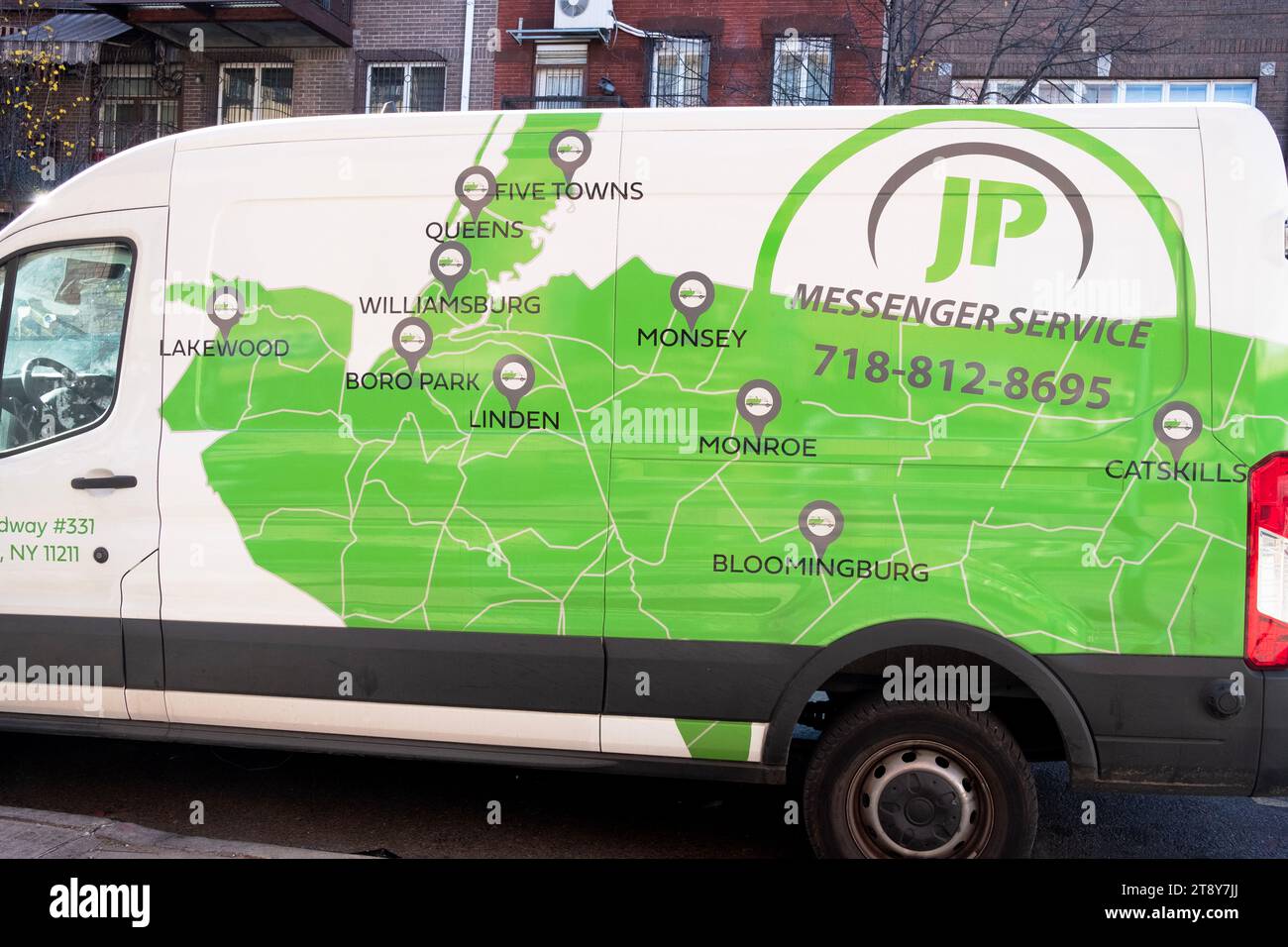 A parked JP Messenger truck with a map showing deliveries to various orthodox Jewish neighborhoods. As seen on Lee Ave. in Williamsburg, Brooklyn, NYC. Stock Photo