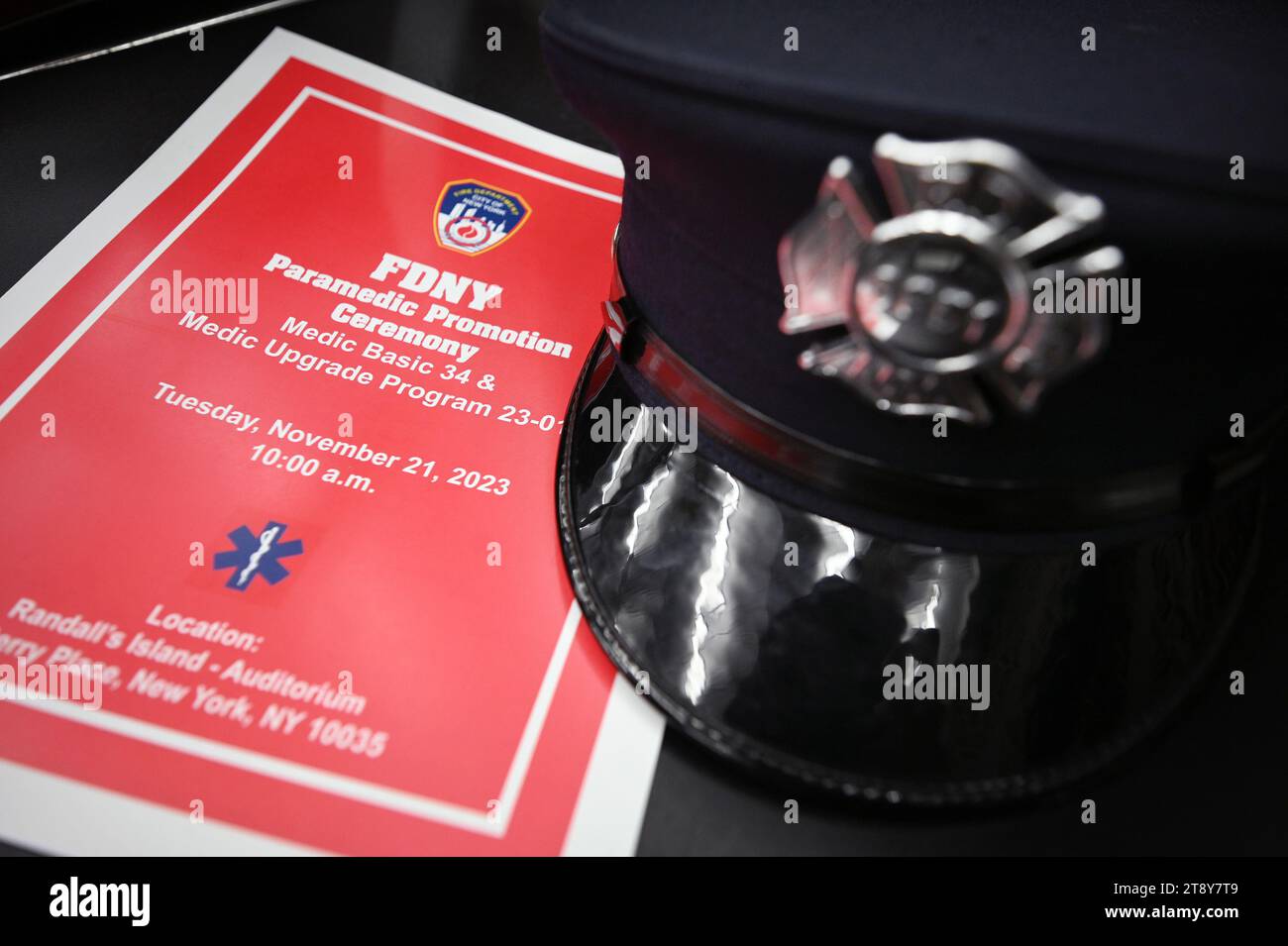 New York, USA. 21st Nov, 2023. A FDNY hat sits on a chair at the FDNY graduation ceremony for 80 Paramedics at the FDNY's Training Academy Auditorium on Randall's Island, New York, NY, on November 21, 2023. (Photo by Anthony Behar/Sipa USA) Credit: Sipa USA/Alamy Live News Stock Photo