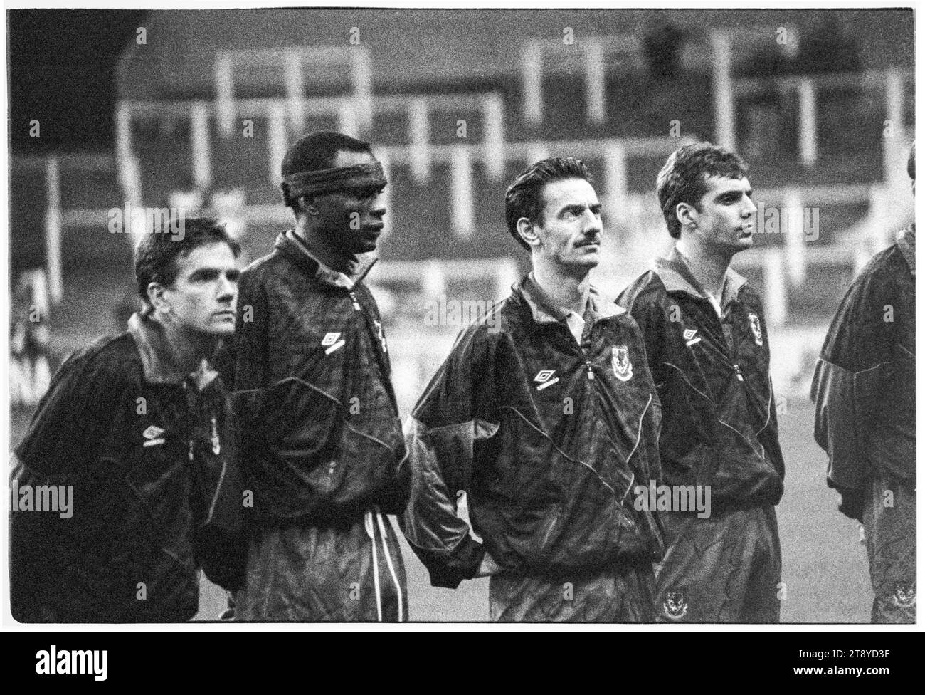 Welsh goalscoring legend Ian Rush stands between defenders Eric Young and Andy Melville. FIFA World Cup 1994 Group 4 Qualification – Wales v Romania at Cardiff Arms Park, Wales, UK on 17 November 1993. A win for Wales in this final group game would confirm qualification as the only representative from the UK. At 64 minutes with the score at 1-1 Wales had a penalty to take the lead but Paul Bodin’s spot kick hit the bar. Florin Raducioiu scored the winner for Romania on 82 minutes and they qualified instead. Photo: Rob Watkins Stock Photo