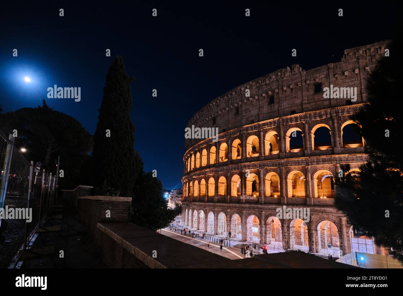 Rome, Italy - November 4 2023: The Colosseum, Architectural wonder of Roman Empire (Colosseo) night view with moonlight Stock Photo