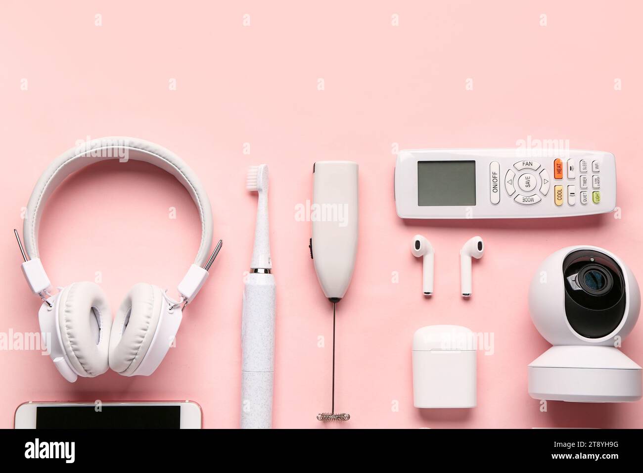 Modern gadgets on pink background Stock Photo