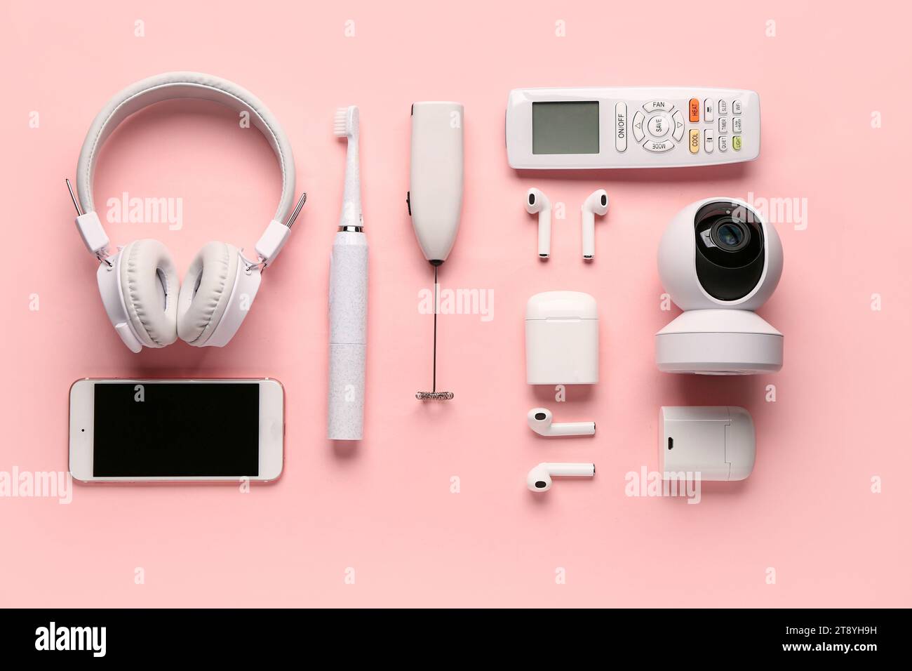 Modern gadgets on pink background Stock Photo