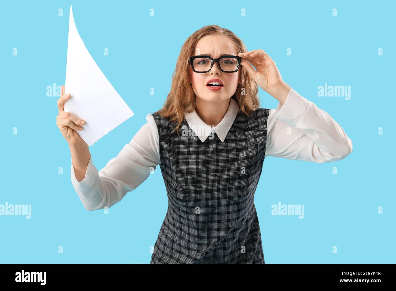 Beautiful actress with film script on blue background Stock Photo - Alamy