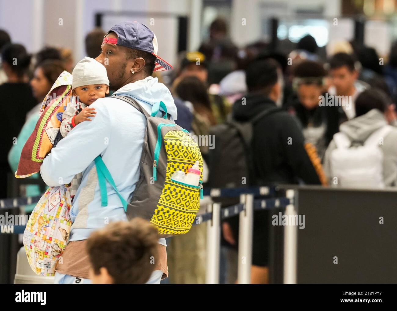 Travelers wait in line for security at Bush Intercontinental