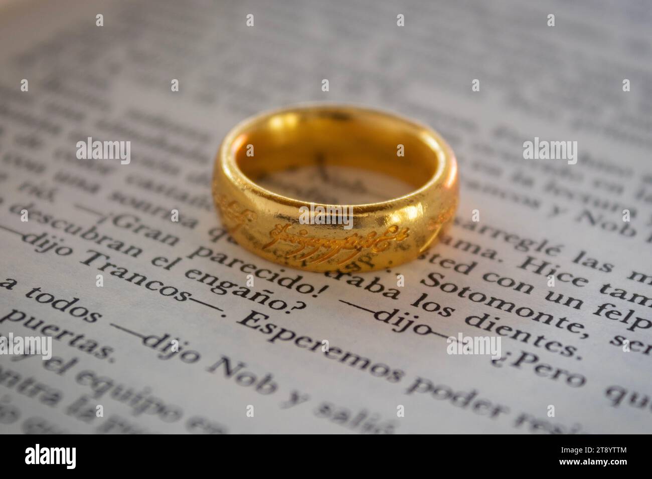 Close up to The ring of power of sauron over a Lord of the rings text