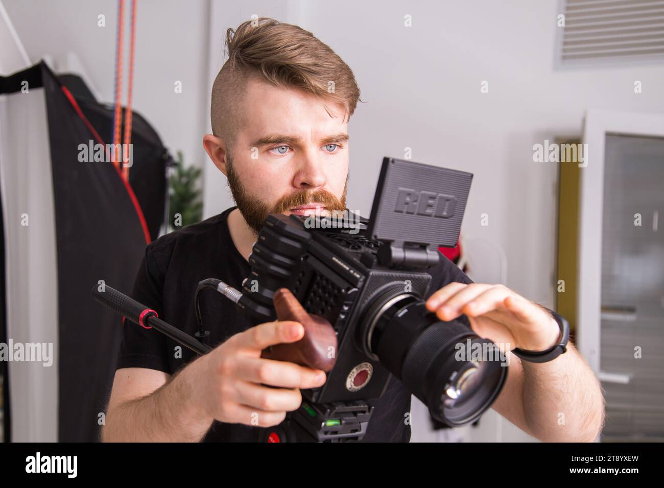 UFA, RUSSIA - 29 FEBRUARY 2020: cameraman works with Red digital cinema cameras. RED is the leading manufacturer of professional digital cinema Stock Photo