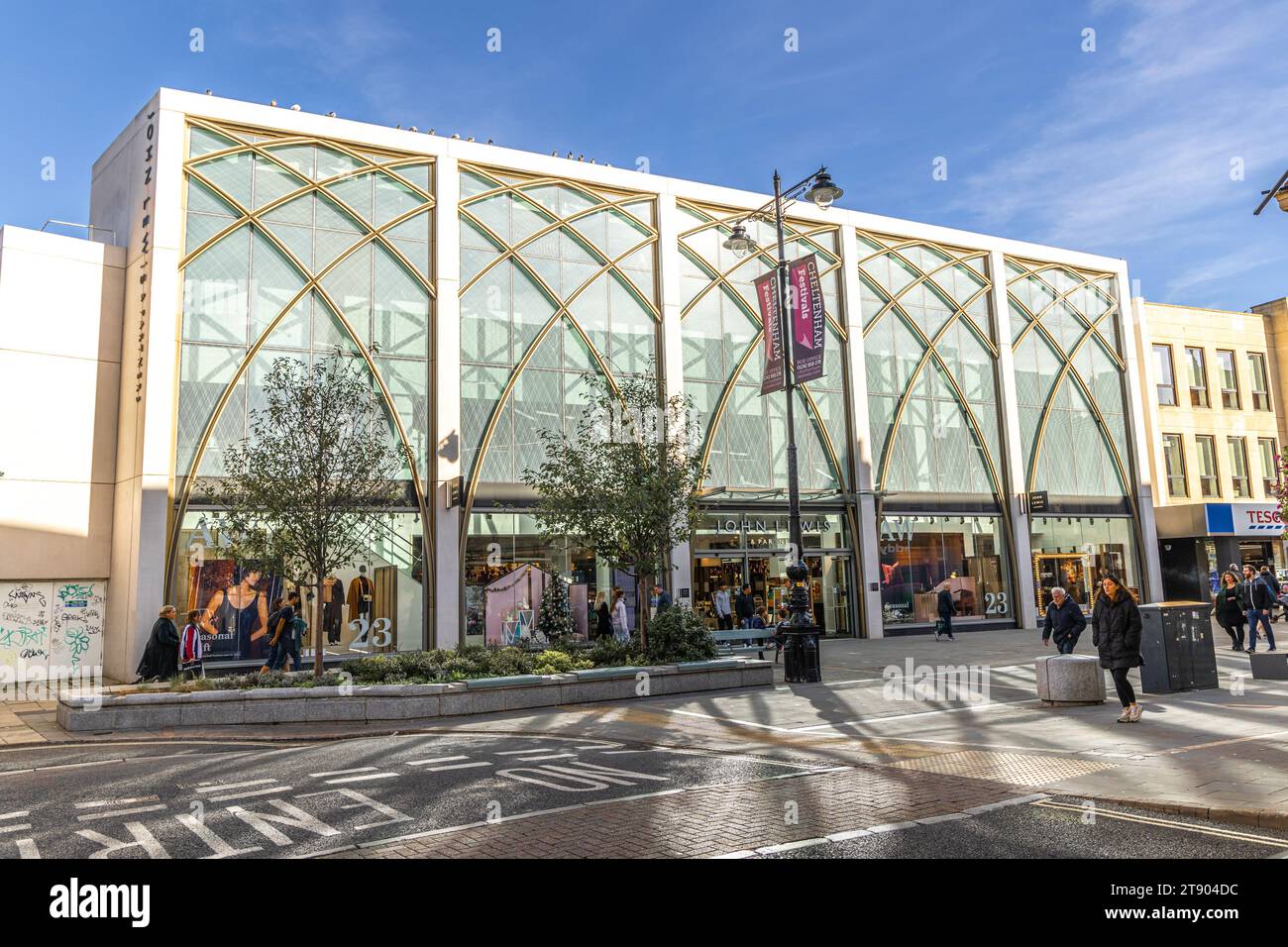 Cheltenham, UK - October 15, 2023: Shoppers on the High Street in Cheltenham in front of the new John Lewis store which opened in October 2018 Stock Photo