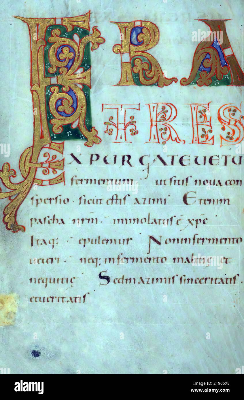 Lectionary, Fratres, This Lectionary was created ca. 1000 in Trier. Written in a clear Caroline minuscule, it contains decorated initials at the openings of important readings. A set of illuminated letters marks the beginning of the Epistle and Gospel lessons for Easter; they display the hierarchy of scripts with capital letters decorated with gold leaf or drawn in red ink, followed by uncial and Caroline minuscule. Initials in orange, sometimes filled with gold, mark the divisions of the text Stock Photo