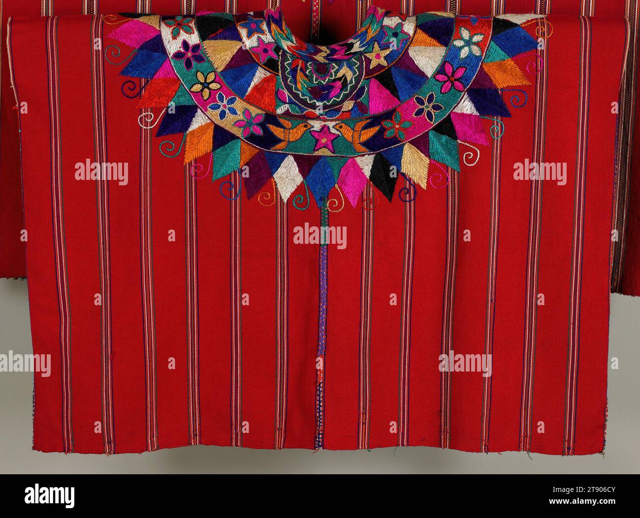 Woman's ceremonial blouse (Huipil), c. 1950s, 24 1/8 x 33 1/2 in. (61.28 x 85.09 cm), Cotton, silk; embroidery, appliqué, Guatemala, 20th century, Many ancient cultures of the Americas used feathers to embellish clothing, headdresses and ritual objects, and the Maya were no exception. Images on Classic Maya pottery and murals clearly show feathers adorning deities, warriors and nobility. The women of Patzún embroider stylized feather shapes on their ceremonial huipiles, referencing the myths and customs of the ancestors. These feathers encircle the head opening of the huipil Stock Photo