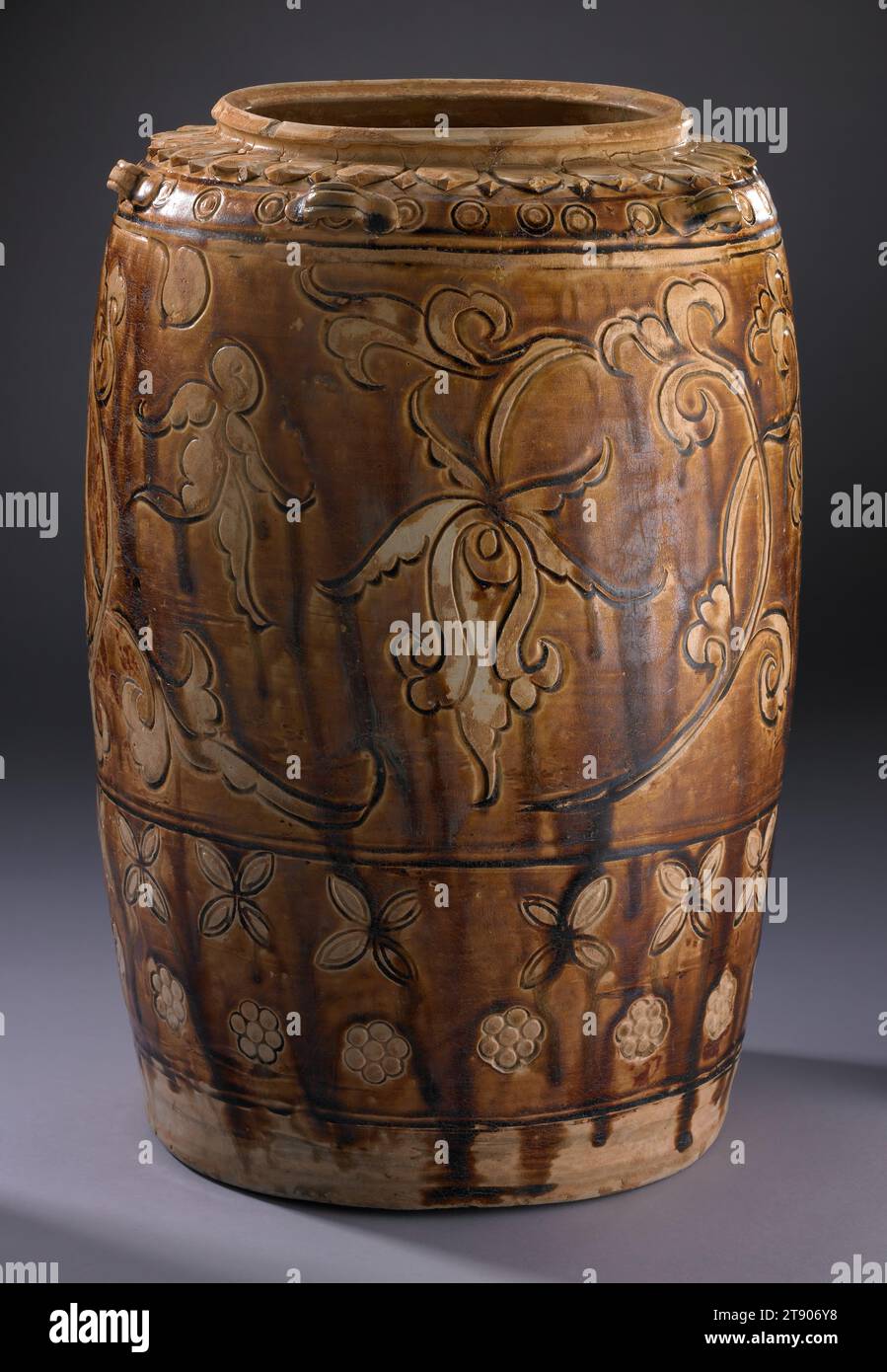 Storage Jar, Ly dynasty, 11th-13th century, 14 1/2 x 10 3/16 x 10 3/16 in. (36.83 x 25.88 x 25.88 cm), Stoneware, Vietnam, Ly dynasty, 11th-13th century, After more than 1,000 years of varying degrees of Chinese occupation, the people of northern Vietnam gained their independence and established a capital at present-day Hanoi. This period of freedom saw a flourishing of Vietnamese culture. The selective adoption of neighboring Chinese developments in ceramics created distinctly Vietnamese forms. The spontaneity of line, color, and pattern are hallmarks of Vietnamese ceramics Stock Photo