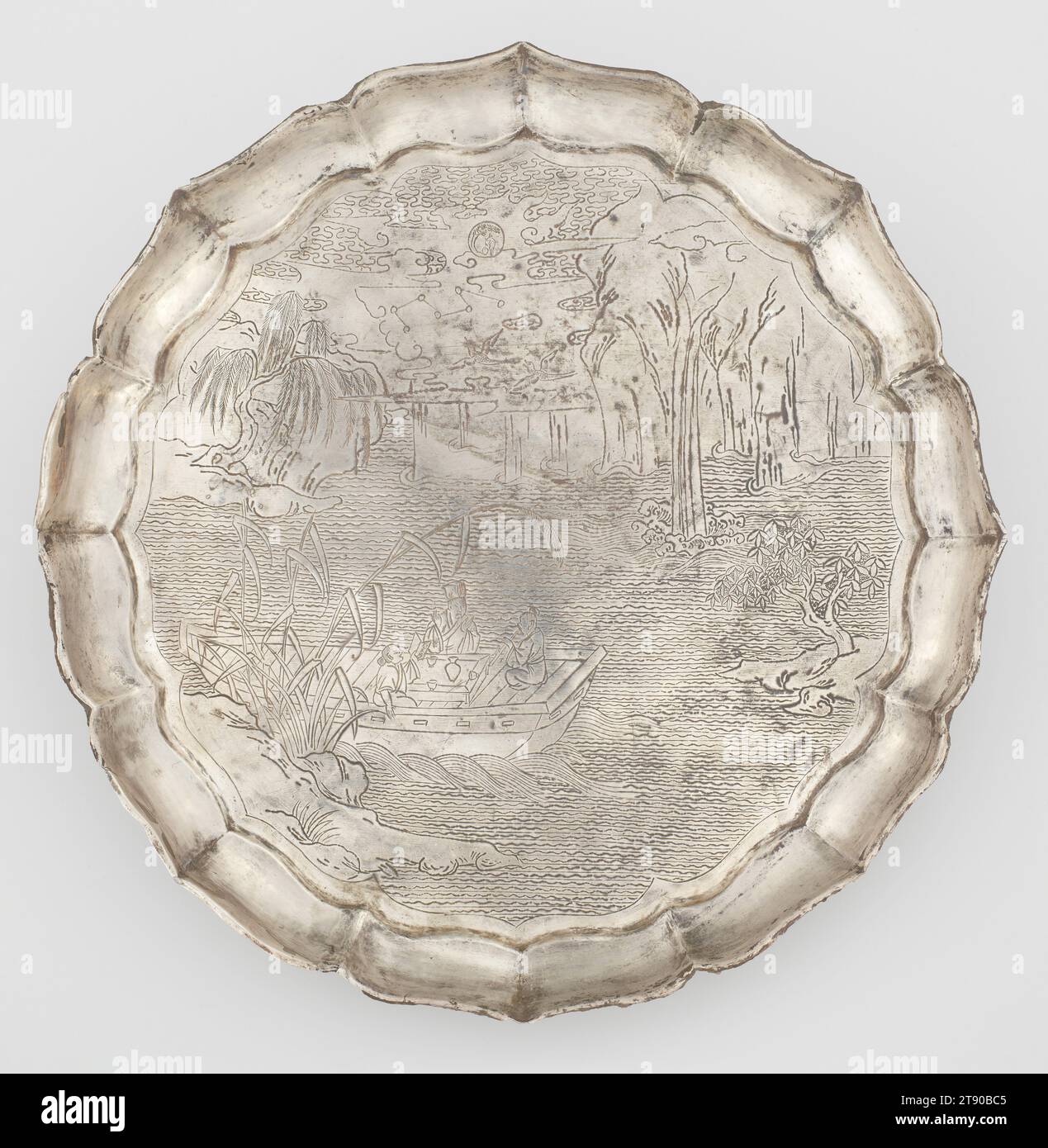 Silver plate decorated with chased 'Red Cliff' scene, 13th century, 7/8 x 10 5/16 x 10 5/16 in. (2.22 x 26.19 x 26.19 cm), Silver, China, 13th century, Framed by an elegant foliate rim, the pictorial scene from the 'Former Red Cliff Ode' by Su Shi (1037–1101) shows him with two companions boating beneath the Red Cliff, a famous ancient battle site along the Yangzi River. A wine pot and cups are set before them. They read poetry and play music as the boat drifts idyllically beside a rocky embankment covered with grasses, and a waterfall spills down from the high cliffs at the far shore. Stock Photo