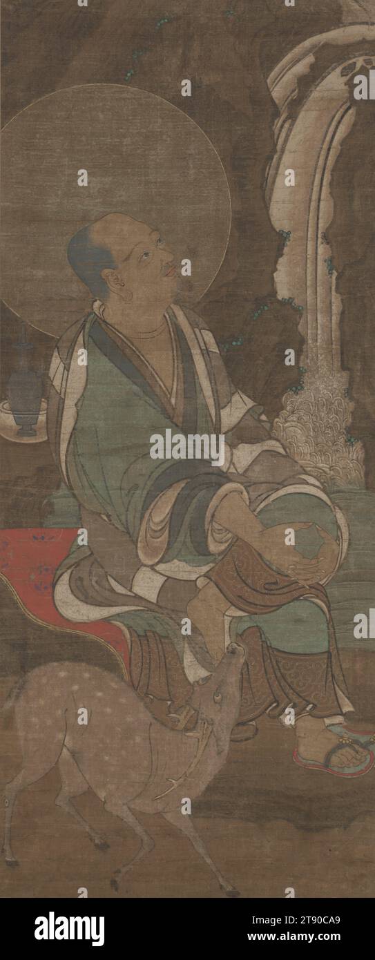 Piṇḍolabbaradvāja, the First of the Sixteen Arhats, 13th - early 14th century, Unknown Japanese, 37 3/4 × 15 3/4 in. (95.89 × 40.01 cm) (image)68 × 22 1/2 in. (172.72 × 57.15 cm) (mount), Ink, color, and gold leaf on silk, Japan, 13th-14th century, Buddhist 'achievers' or rakan strive for 'awakening'—enlightenment—and the attaining of nirvana. Rakan could be depicted in a more natural, life-like manner or with grotesquely distorted features. The image of the running waterfall in the background and a deer standing next to a seated rakan figure might depict the third rakan, Kanaka Stock Photo