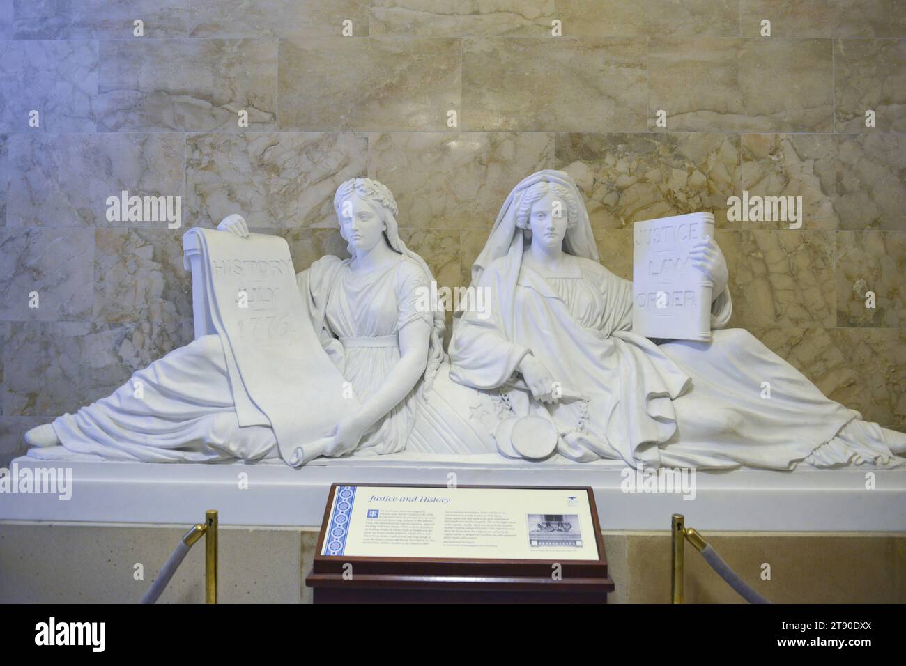 Marble statues of Justice and History featuring two draped women