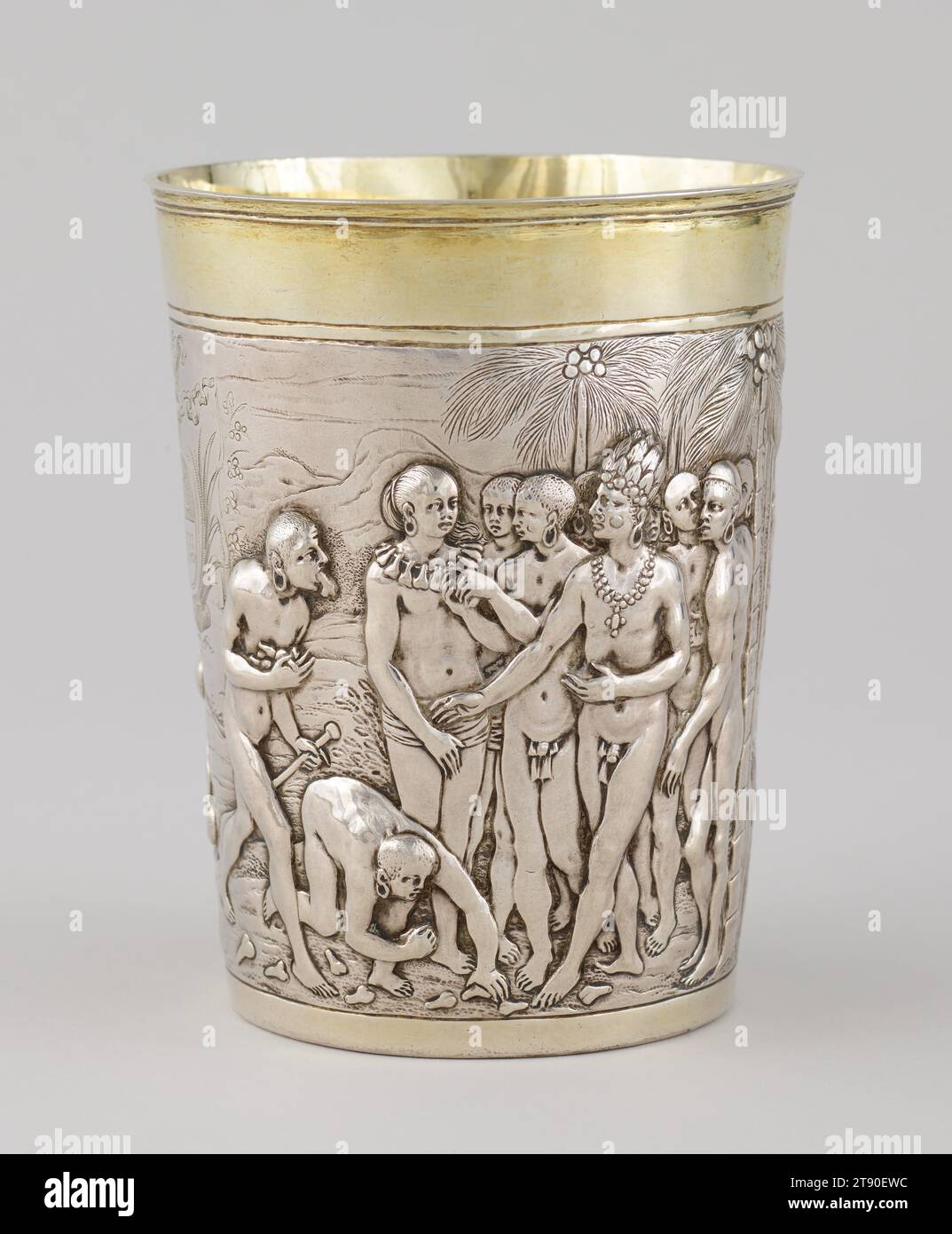 Beaker, 1647-1650, Melchior Lauch, German, documented 1622 - 1659, 5 1/2 × 4 7/8 × 4 7/8 in. (14 × 12.38 × 12.38 cm), Silver, gilt, Germany, 17th century, This beaker depicts the battles and warfare of different tribes in Mozambique, as described and imagined by the Dutch merchant Jan Huyghen van Linschoten (1563-1611), who had lived in Goa, India, for six years, and wrote an influential account of his travels through Africa and India. It was made in Leipzig, Germany, which was a center of trade, based on engravings in Jan Huyghen’s book. Such depictions of exotic peoples in faraway places Stock Photo