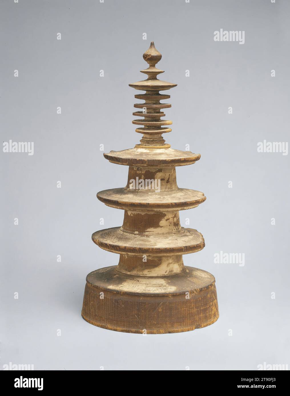 Pagoda with Darani sutra, from a set of 'One Million Pagodas', 767, Unknown Japanese, 8 9/16 × 4 1/4 × 4 3/16 in. (21.75 × 10.8 × 10.64 cm), Japanese cypress (hinoki) and Cleyera ochnacea japonica (sakaki), Japan, 8th century, According to Japan’s earliest recorded histories, in the mid-760s, the Empress Shōtoku (718–770) commissioned the production of one million miniature scrolls printed with Buddhist incantations, each one enshrined within a small wooden pagoda. When they were completed, the empress donated 100,000 scroll-pagoda combinations to each of the ten major Buddhist temples in Nara Stock Photo