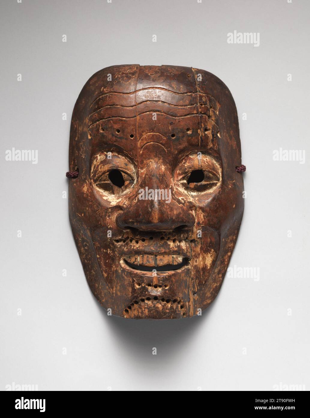 Noh Mask of a Man, 16th century, Unknown Japanese, 8 9/16 × 6 1/16 × 2 7/8 in. (21.75 × 15.4 × 7.3 cm), Polychromed wood, Japan, 16th century, Noh masks were typically made of cypress wood, primed with gofun (shell white) and animal glue, and colored with mineral pigment. They developed out of gigaku, a type of masked dance with mime that originated in Baekje, one of the Three Kingdoms of Korea (57 BC to 668 AD). During Noh performances, the actor in the principal role known as shite wears masks to play supernatural beings, women, and the elderly. Because Noh actors were limited to men Stock Photo
