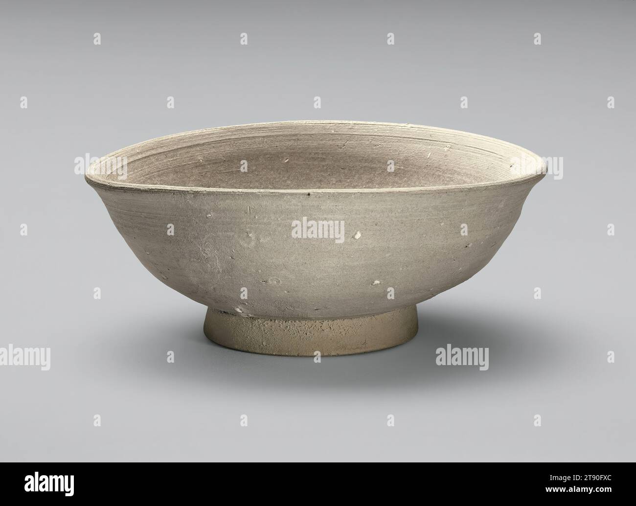 Bowl, 12th century, Unknown Japanese, 2 7/16 × 5 3/4 × 6 3/16 in. (6.19 × 14.61 × 15.72 cm), Sanage ware; stoneware, Japan, 12th century, Sanage ware resembles Chinese ceramics, having emerged in the 700s as an affordable substitute for expensive imported Chinese ceramics and the Japanese luxury wares they inspired. Known as the earliest glazed stoneware in Japan, Sanage ware was primarily made in central Honshū, the largest and most populous island of Japan, and remained popular until the 1100s, when it was superseded by another type of glazed stoneware produced in the region Stock Photo
