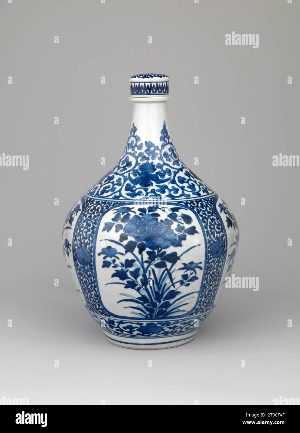 Apothecary bottle with mynas and peonies, c. 1660-1680, Unknown Japanese, 20 1/4 × 13 3/8 × 13 3/8 in. (51.44 × 33.97 × 33.97 cm), Imari ware; porcelain with underglaze cobalt blue, Japan, 17th century, In the 1500s and 1600s, blue-and-white porcelains made at China’s famed Jingdezhen kilns were extremely popular in Europe, where the technology required to produce porcelain would not be known for another 200 years. When the Jingdezhen kilns entered a period of decline in the mid-1700s, porcelain makers in a town in far western Japan called Arita seized the opportunity Stock Photo