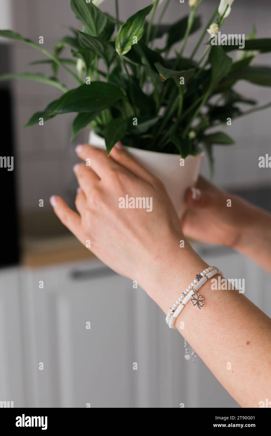 Woman wearing gold bracelets hi-res stock photography and images - Alamy