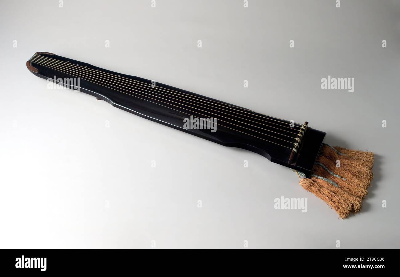 Zither named 'Flowing Water', 1794, Nakamura Sōtetsu, 3 × 32 3/8 × 5 3/8 in. (7.62 × 82.23 × 13.65 cm), Wood with black lacquer and mother-of-pearl inlay; silk tassels, Japan, 18th century, The seven-stringed zither, called kin in Japanese, has been played in China (where it is called qin) for at least 3,000 years. It was introduced to Japan by the 700s and was a common instrument in the cultural sphere represented in The Tale of Genji. This example of a kin was created by an artist of the celebrated Nakamura family of lacquerers, all of whom used the given name Sōtetsu. Stock Photo