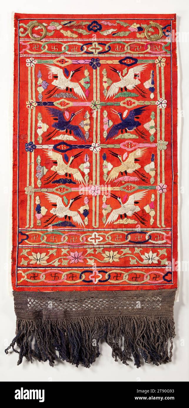 Decorative hanging panel of an official’s robe, 19th century, Unknown Korean, 10 1/4 × 21 11/16 in. (26.04 × 55.09 cm) (including fringe), Silk thread embroidery on silk, Korea, 19th century, This embroidered silk textile is an example of a decorative panel, called a husu, that would have decorated the back of an official’s courtly or ceremonial garb. The motif and materials of husu were differentiated based on the official’s position and rank. This late Joseon example featuring four pairs of facing cranes, in blue, yellow, and white, would have been reserved for a civil official. Stock Photo