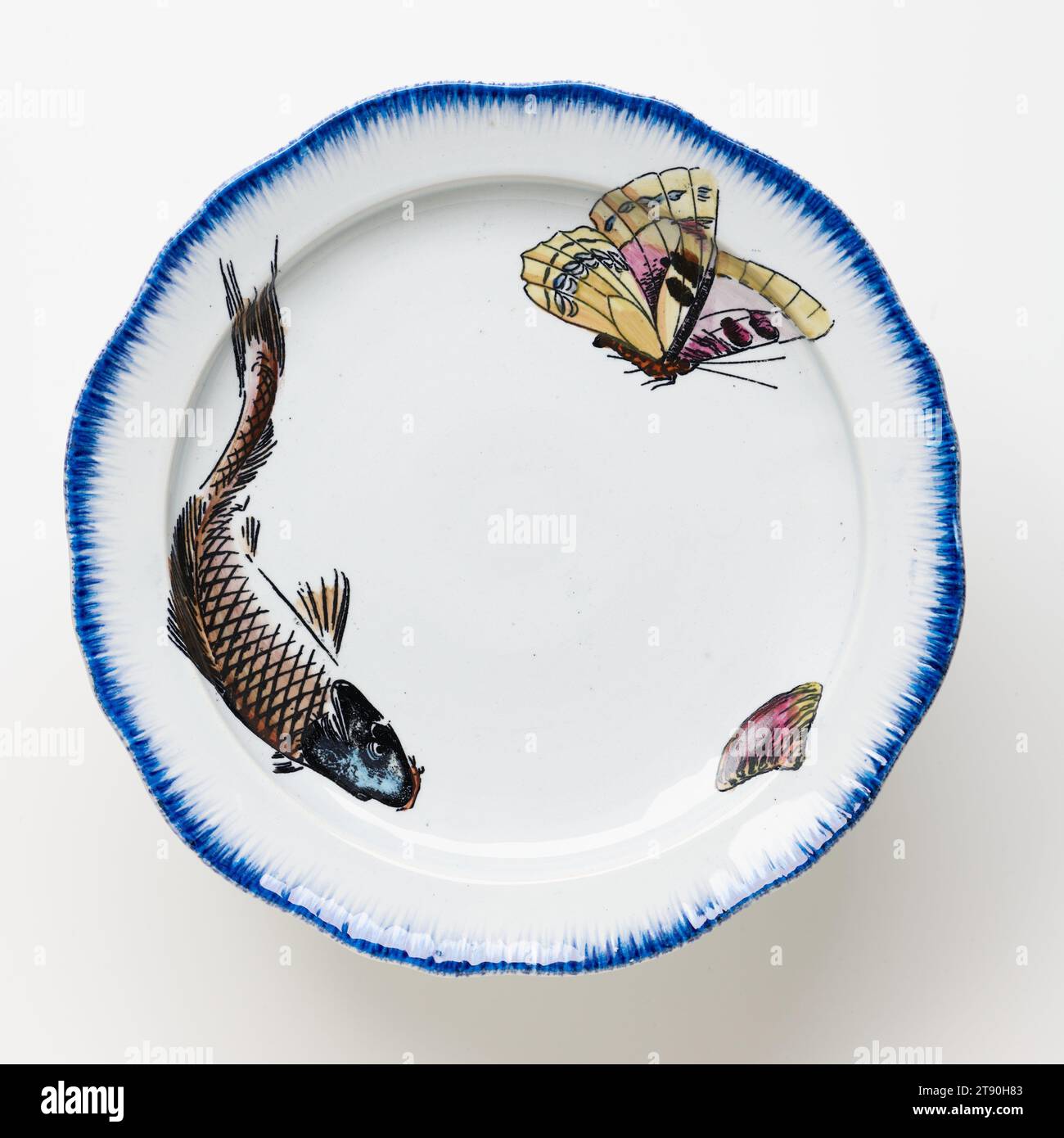 Cake plate with fish, butterfly, and shell, 1866-1867, Félix Bracquemond; Manufacturer: Lebeuf, Milliet & Co., Creil; Retailer: Francois-Eugene Rousseau, French, 1833–1914, 3 × 8 3/4 in. (7.62 × 22.23 cm), Lead-glazed earthenware, transfer printing, France, 19th century, This platter and three footed plates come from a large table service commissioned by the French dealer and publisher Eugène Rousseau (1827-1890) and designed by the painter and print maker Felix Bracquemond. First exhibited in Paris at the Universal Exhibition in 1867 Stock Photo