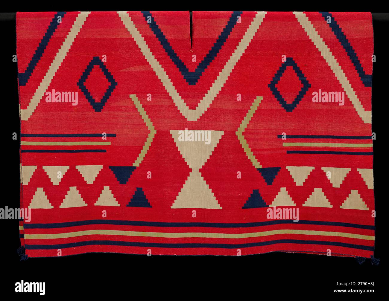 Poncho serape, c. 1860, 72 × 52 in. (182.88 × 132.08 cm) (overall, with fringe), Wool, dye, United States, 19th century, This poncho serape, made by a Navajo woman around 1860, was worn as an outer garment. The wearer would put his or her head through the slit in the middle of the central diamond, and the white hourglass shapes would fall over the arms. The pattern is emblematic of hózhǫ́, a fundamental Navajo concept emphasizing the connection among beauty, symmetry, health, and harmony. Other aspects of this blanket can be traced to cultural and economic exchanges with Spanish Stock Photo