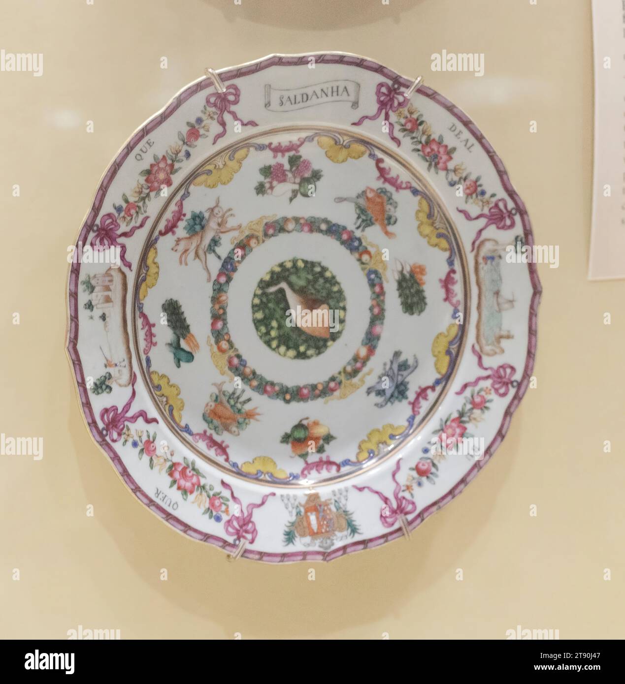 Plate with the arms of Saldanha for the Portuguese market, c. 1760-1770, 1 x 9 3/16 in. (2.54 x 23.34 cm), Porcelain, China, 18th century, This plate formed part of a large dinner service commissioned by the Saldanha de Albuquerque family of Portugal. This service is one of the most unusual Chinese Export services to have been produced during the eighteenth century. Typical services were decorated with family coats of arms, designs copied from European prints, Chinese-style figures or floral motifs. Rather than emphasizing the family's coat of arms, the service celebrates food: a large ham Stock Photo
