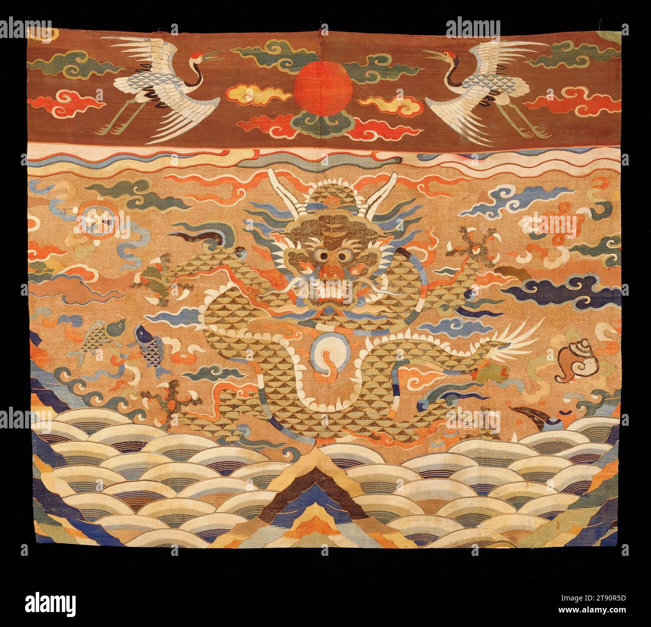 Altar Frontal, early 17th century, H. 33 ¼ in x W. 38 ¼ in. (83.82 x 96.52 cm), silk tapestry (kesi), China, 17th century, The upper section of this altar frontal depicts a sun disk flanked by Manchurian cranes in a field of clouds. The main section boasts a large dragon in a celestial landscape of clouds, mountains, and waves. Throughout the composition is a scattered scheme of the Eight Treasures of Buddhism, like the conch, the endless knot, the wheel of law, and the two golden fish Stock Photo