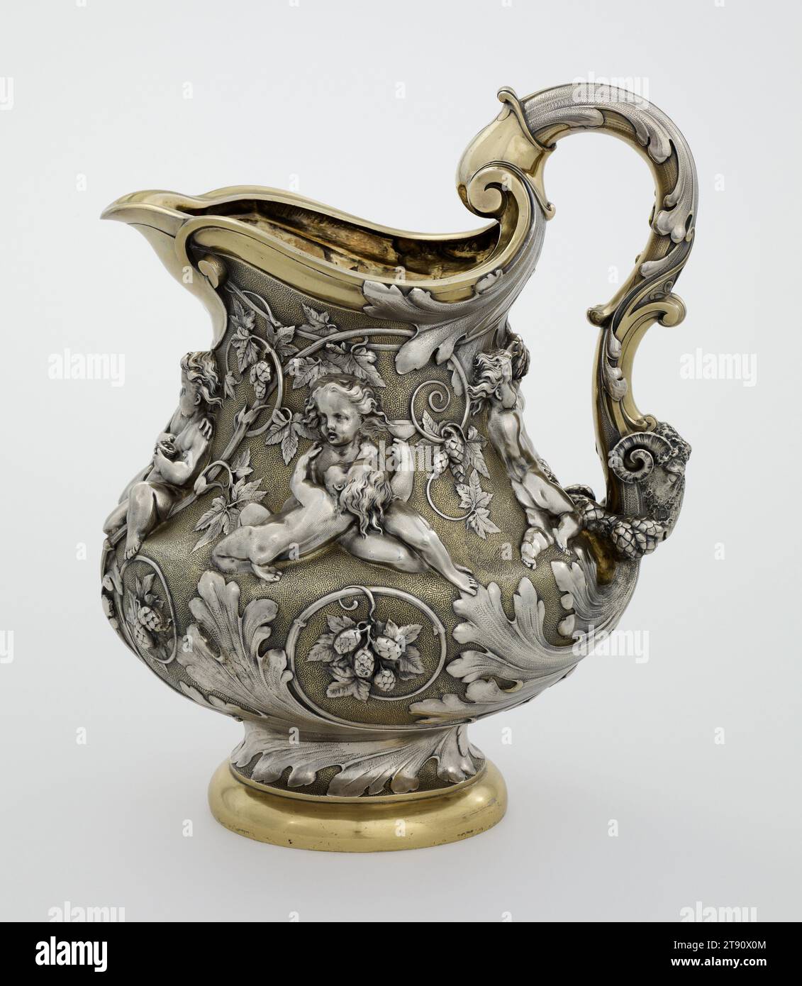 Beer jug, 1884-1885 (designed 1883), Pierre-Emile Jeannest; Manufacturer: Elkington and Co., British, founded 1836, 12 x 7 1/2 x 9 1/4 in. (30.48 x 19.05 x 23.5 cm), Silver, gilt, England, 19th century, Although the firm of Elkington and Company is known for its high quality electroplated silver, the company also manufactured sterling silver. This beer jug, decorated with inebriated putti and surrounded by hop vines was exhibited as part of Elkington's display at the 1855 Paris Exposition Universelle. This jug is a later re-issue of the original design Stock Photo