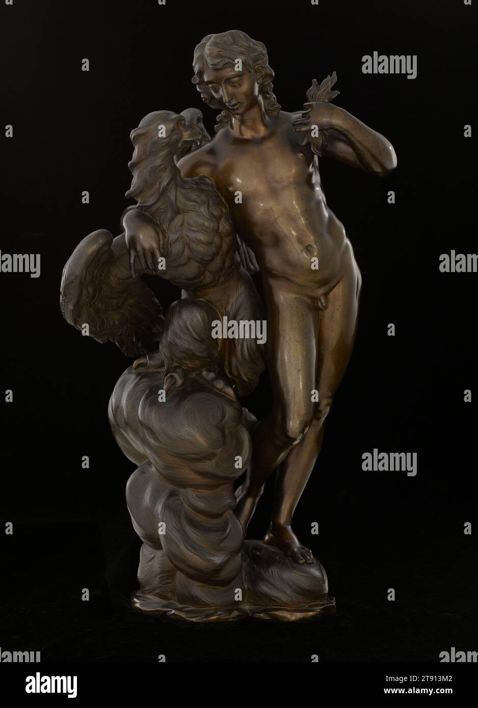 Ganymede and the Eagle, c. 1710, Antonio Montauti, Italian (Florence), Italian, 1664-1742, 18 1/2 in. (46.99 cm), Bronze, Italy, 18th century, Captivated by the beauty of the shepherd Ganymede, Zeus transformed himself into an eagle and abducted the youth, whom he then installed as cupbearer to the gods on Mount Olympus for eternity. In most representations, the mortal shepherd boy is shown overpowered by the formidable eagle, but here Ganymede stands upright and engages with the eagle through a gesture of affection and familiarity. Stock Photo