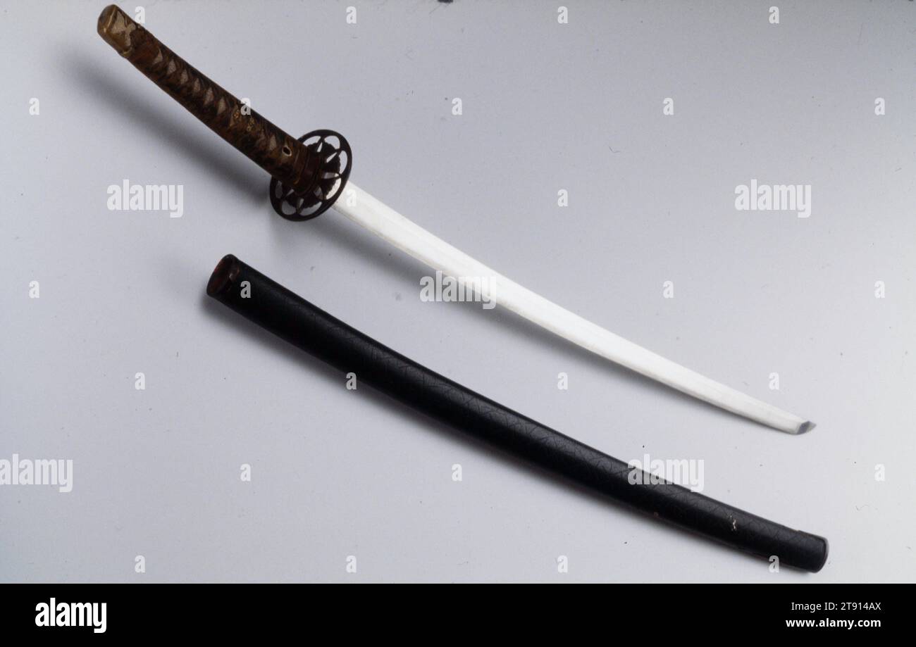 Katana blade of a shortened tachi in 20th-century mount with World War II officer sword handle, 14th century, Unknown Japanese, 10 x 1 1/2 in. (25.4 x 3.81 cm) (b), Wood, lacquer, sharkskin, silk, metal, Japan, 14th century Stock Photo
