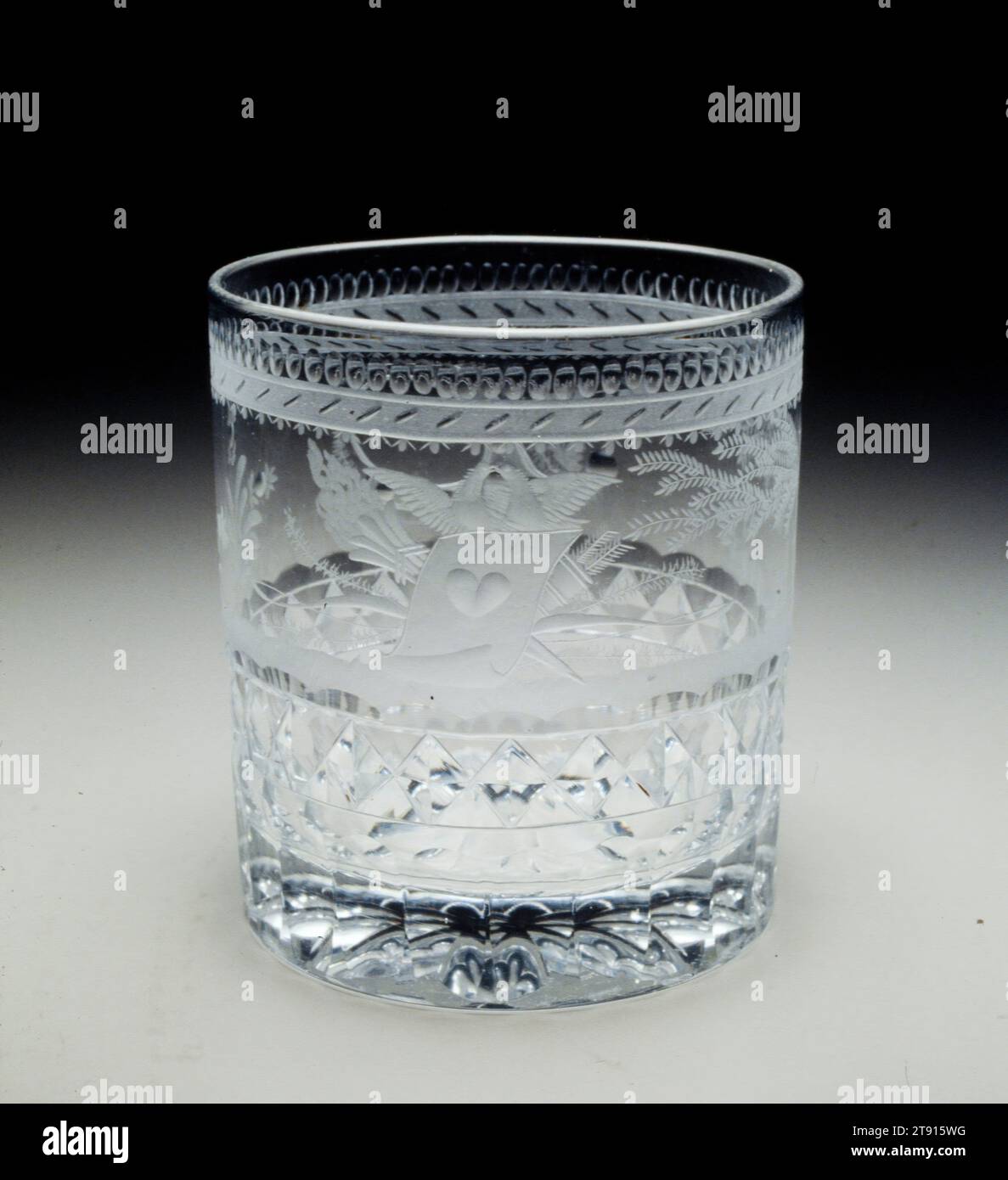 Friendship tumbler, c. 1825, Attributed to Bakewell, Page and Bakewell, Pittsburgh, Pennsylvania, 1808-1882, 3 3/8 x 3 1/8 in. (8.6 x 7.94 cm), Cut, etched and engraved glass, United States, 19th Century, The Bakewell firm in Pittsburgh is famous for introducing high quality table glass to America. They are also known for encasing glass with sulphide medallions of important Americans, such as Benjamin Franklin and George Washington, similar to the sulphide of the kneeling slave seen on the English cologne bottle nearby. The neoclassical motifs on this tumbler show Bakewell's supurb cutting Stock Photo