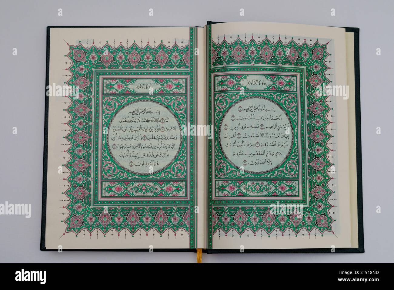 The first page of the original Koran made in Medina. Surah Fatiha. isolated on white background. top view. Stock Photo